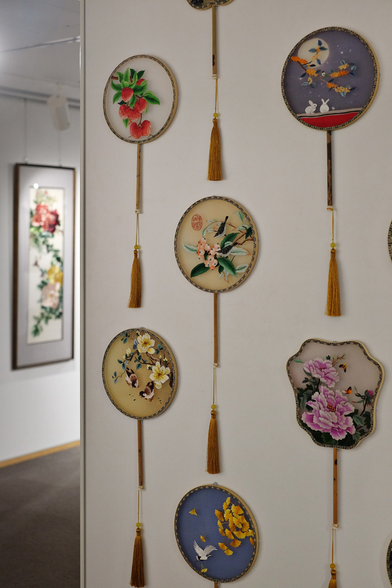 At the opening night of The Charm of the East - Selected Suzhou Embroidery Artworks Exhibition at China Cultural Centre in Sydney. Chinese silk Kesi screen fans.